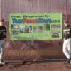 Bottom Lock Fence Slats installed at a baseball field. Slats provided by YourFenceStore.com